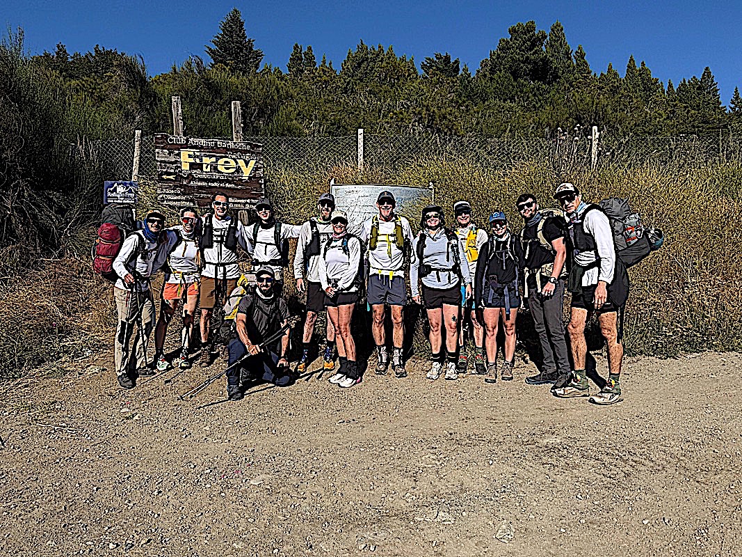 HardWin group loaded with packs at the Refugio Frey trailhead sign