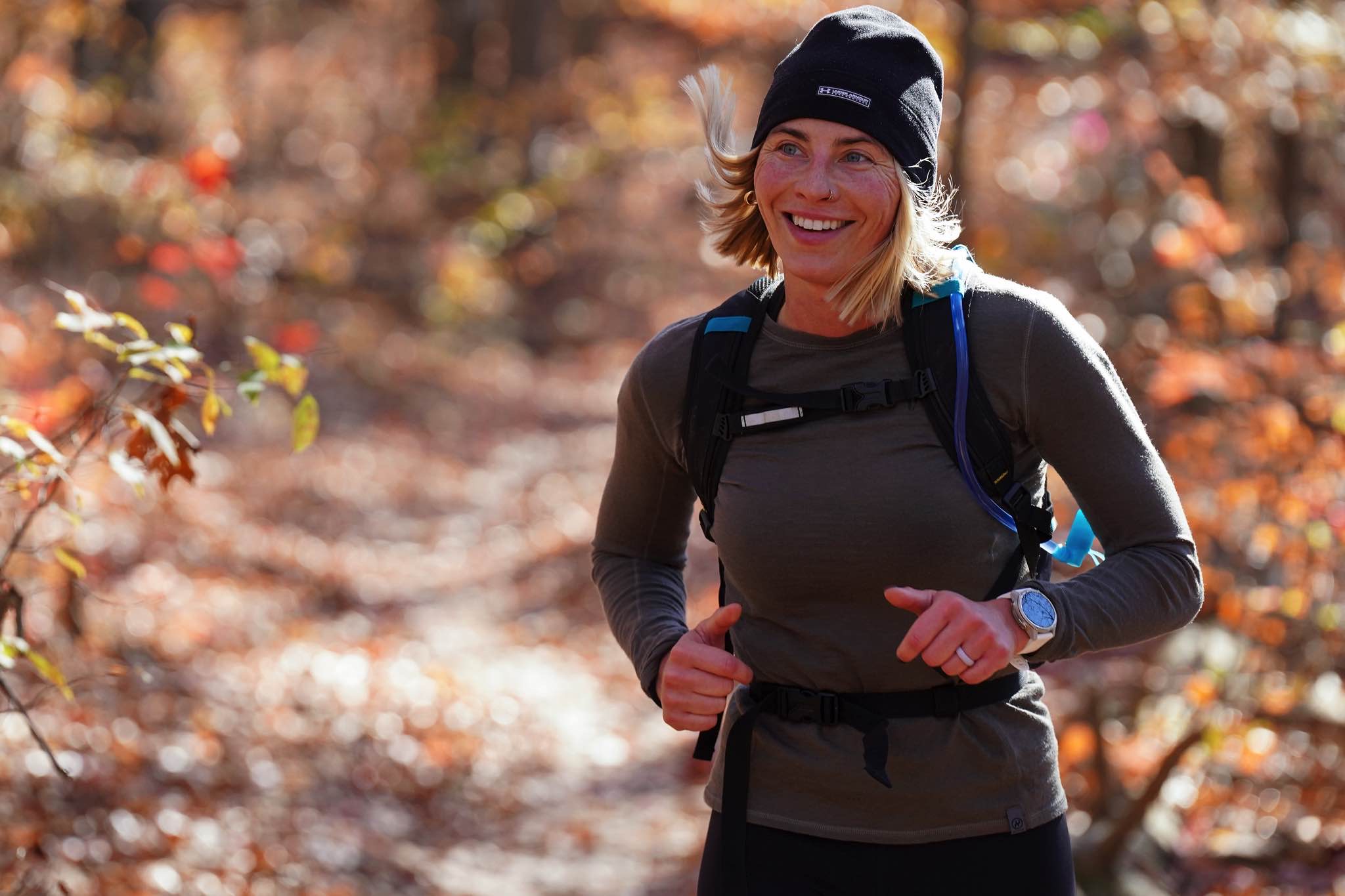 A smiling runner in warm late autumn light