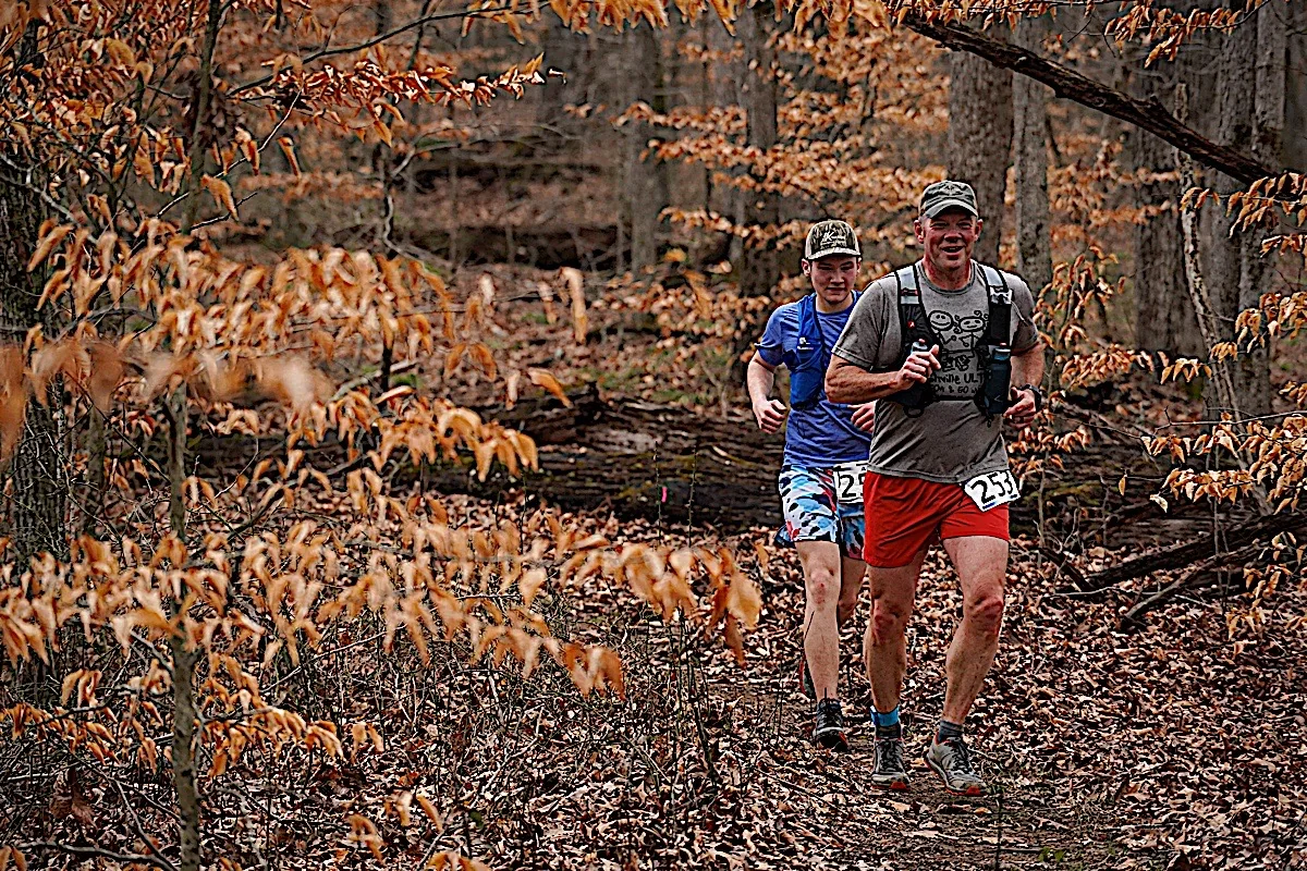 Trail runners in the woods at the Music City Trail Ultra